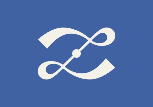 Versione definitiva del monogramma di Laura Zanda: versione in bianco panna su fondo blu acceso.